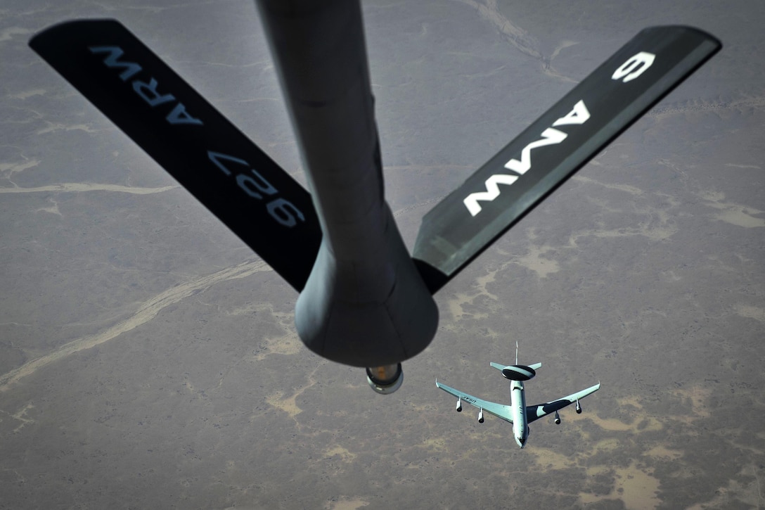 An Air Force E-3 Sentry airborne warning and control system aircraft flies near an Air Force KC-135 Stratotanker aircraft over Iraq, March 22, 2016. Air Force photo by Staff Sgt. Corey Hook
