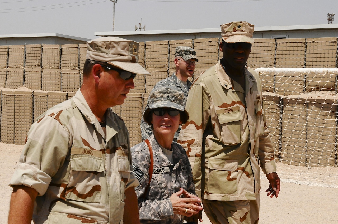 Navy Rear Adm. Jeffrey “Scott” Jones, Coalition Naval Advisory Training Team director, left, and Army Brig. Gen. Camille M. Nichols, commanding general, Joint Contracting Command, U.S. Forces Iraq, tour Umm Qasr, Iraq, Sept. 7, 2010. Nichols visited with the team’s combined forces to view the latest progress at Iraq’s southernmost port. Army photo by Sgt. David Scott