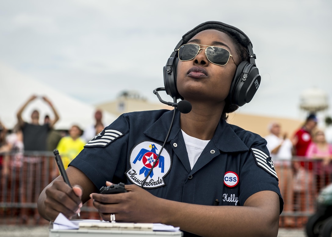 Air Force Tech. Sgt. Shayla Kelly performs timing duties during the Tampa Bay AirFest at MacDill Air Force Base, Fla., March 20, 2016. Kelly is the commander's support staff specialist assigned to the Thunderbirds, the Air Force's air demonstration squadron. Air Force photo by Senior Airman Jason Couillard