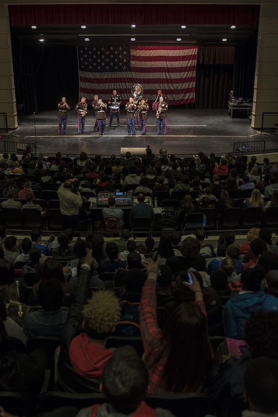 The party band section of the Marine Corps Base Quantico band plays to a full Everett High School auditorium, March 18. The band visited the school prior to their performance in the St. Patrick's Day parade in Boston, Massachusetts, the following weekend.