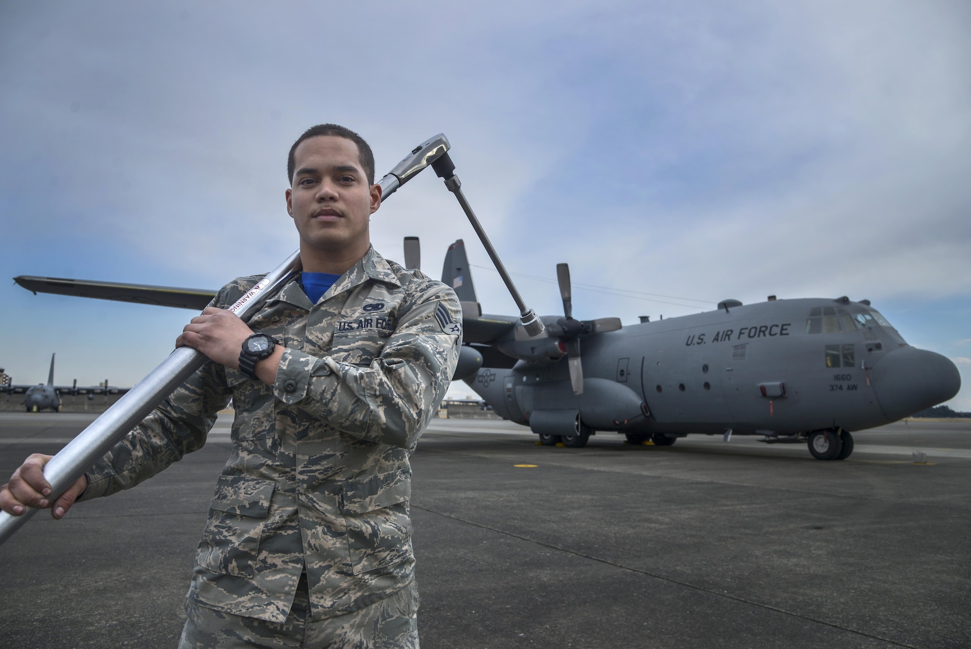 U.S. Air Force Senior Airman David Rivera, 374th Maintenance Flight aerospace propulsion journeyman, holds a torch wrench in front of a C-130 Hercules at Yokota Air Base, Japan, Feb. 26, 2016. Providing in depth maintenance on the aircraft ensures that Yokota’s mission of generating a professional airlift throughout the region is not impacted. (U.S. Air Force photo by Senior Airman David Owsianka/Released)