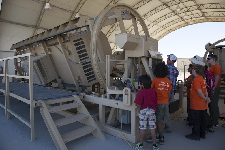 Local Boy Scouts of America troops observe and participate in the Rollover Simulator at the Battle Simulation Center located at Camp Wilson during the Boy Scout Camp Out for local Boy Scouts of America troops March 18, 2016. (Official Marine Corps photo by Sgt. Charles Santamaria/Released)