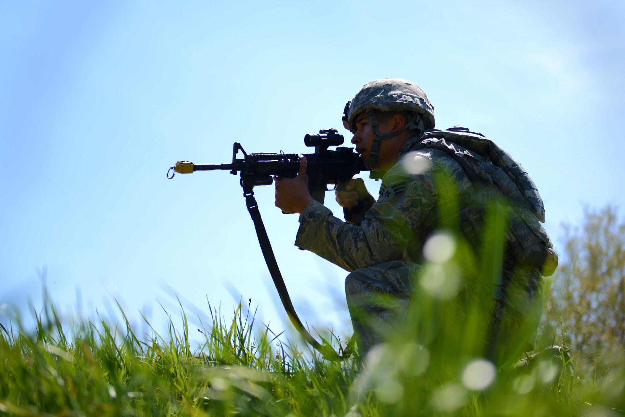 A U.S. Airman assigned to the 20th Security Forces Squadron takes a position to cover his wingmen during a simulated attack during operational readiness exercise Weasel Victory 16-08 at Shaw Air Force Base, S.C., March 23, 2016. OREs are a vital tool used by the Department of Defense to test and train troops for combat situations. (U.S. Air Force photo by Airman 1st Class Kelsey Tucker)