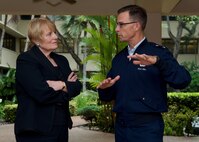 U.S. Air Force Maj. Gen. Mark Dillon, Pacific Air Forces vice commander, gives Hon. Catherine Ebert-Gray, U.S. Ambassador to Papua New Guinea, Vanuatu and the Soloman Islands, a tour of the Courtyard of Heroes during her visit of PACAF headquarters. (U.S. Air Force photo by Tech. Sgt. James Stewart/Released)