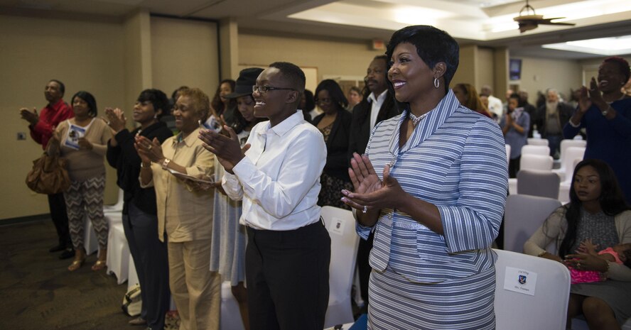Family and friends celebrate during U.S. Air Force Chief Master Sgt. Samuel Freeman’s retirement ceremony, March 25, 2016, at Moody Air Force Base, Ga. As the 23d Logistics Readiness Squadron’s chief enlisted manager, Freeman managed an approximate $400 million supply account directly supporting over 6,000 aircraft sorties annually. (U.S. Air Force photo by Airman 1st Class Greg Nash/Released)  