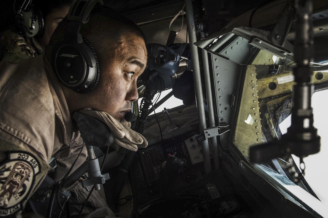 Air Force Staff Sgt. Caesar Lazaro operates the boom of a KC-135 Stratotanker aircraft to support Operation Inherent Resolve over Iraq, March 22, 2016. Lazaro is a boom operator assigned to the Hawaii Air National Guard’a 203rd Air Refueling Squadron. Air Force photo by Staff Sgt. Corey Hook