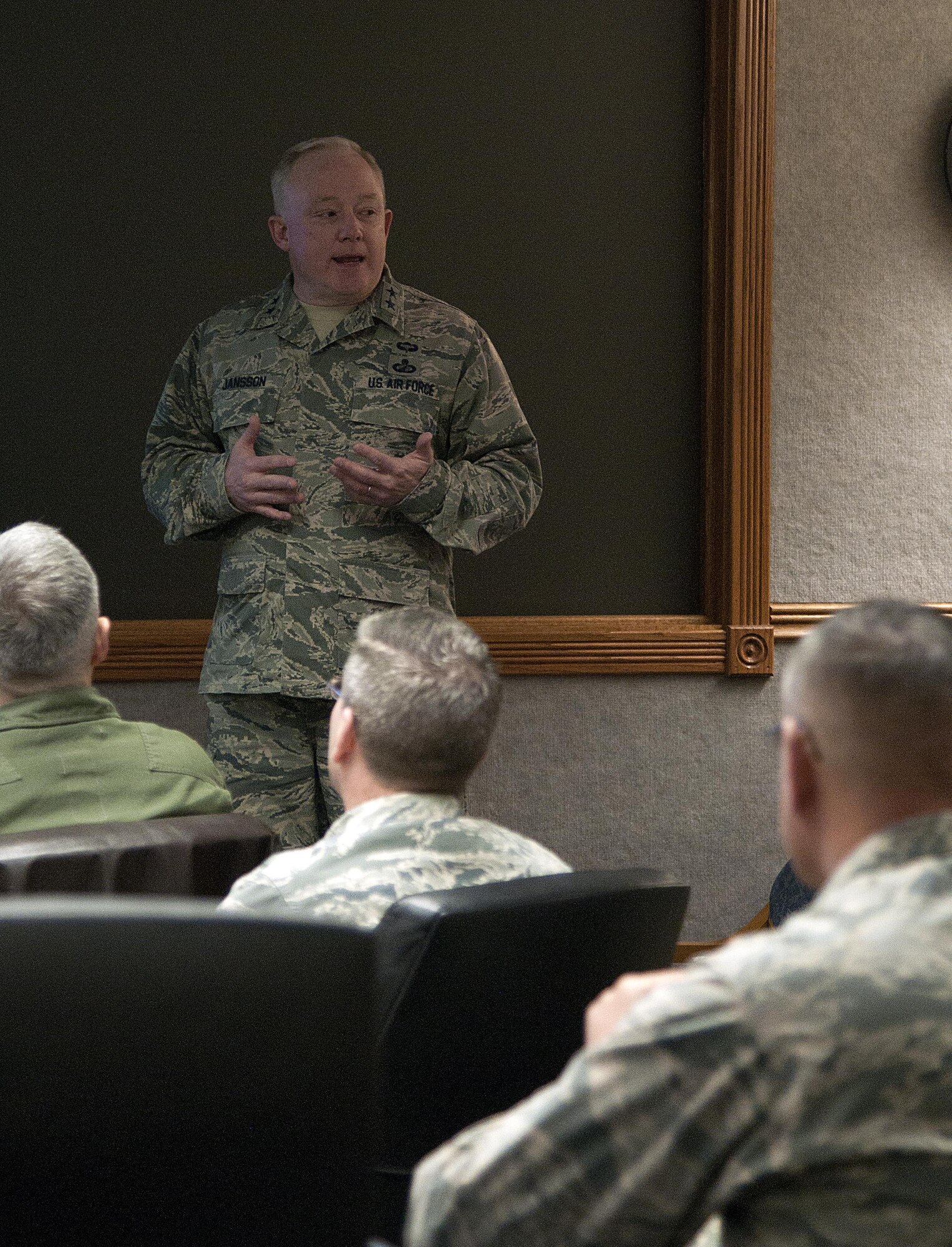 Maj. Gen. Scott Jansson, Air Force Nuclear Weapons Center commander, speaks with 90th Missile Wing Leadership March 25, 2016, inside the wing conference room, Bldg. 250, on F.E. Warren Air Force Base, Wyo. Jansson visited the three missile wings and the bomber wings to familiarize himself with the state of the nuclear community. (U.S. Air Force photo by Senior Airman Brandon Valle)