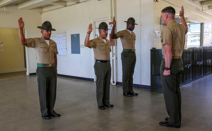 Drill instructors of Bravo Company, 1st Recruit Training Battalion, recite the Drill Instructor Creed during pick up at Marine Corps Recruit Depot San Diego, March 11. After spending the first week in-processing, recruits marched to their new squad bay where their drill instructors introduced themselves, recited the Drill Instructor Creed and began to carrying out the mission of transforming civilians into United States Marines. Annually, more than 17,000 males recruited from the Western Recruiting Region are trained at MCRD San Diego. Bravo Company is scheduled to graduate June 17.