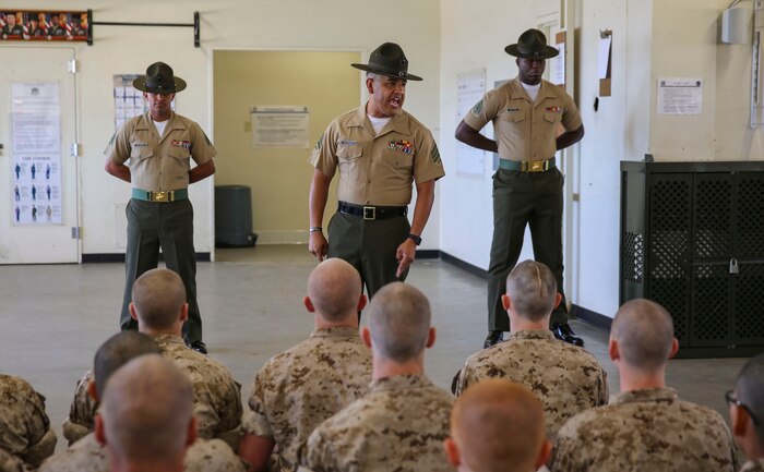 Sergeant David A. Herrera, senior drill instructor, Bravo Company, 1st Recruit Training Battalion, gives directions to his new recruits and explains his expectations from them during pick up at Marine Corps Recruit Depot San Diego, March 11. In the first hours recruits are with their drill instructors, they learn the rules and regulations of recruit training, covering everything from how to act in the squad bay to how to speak to the drill instructors. Annually, more than 17,000 males recruited from the Western Recruiting Region are trained at MCRD San Diego. Bravo Company is scheduled to graduate June 17.