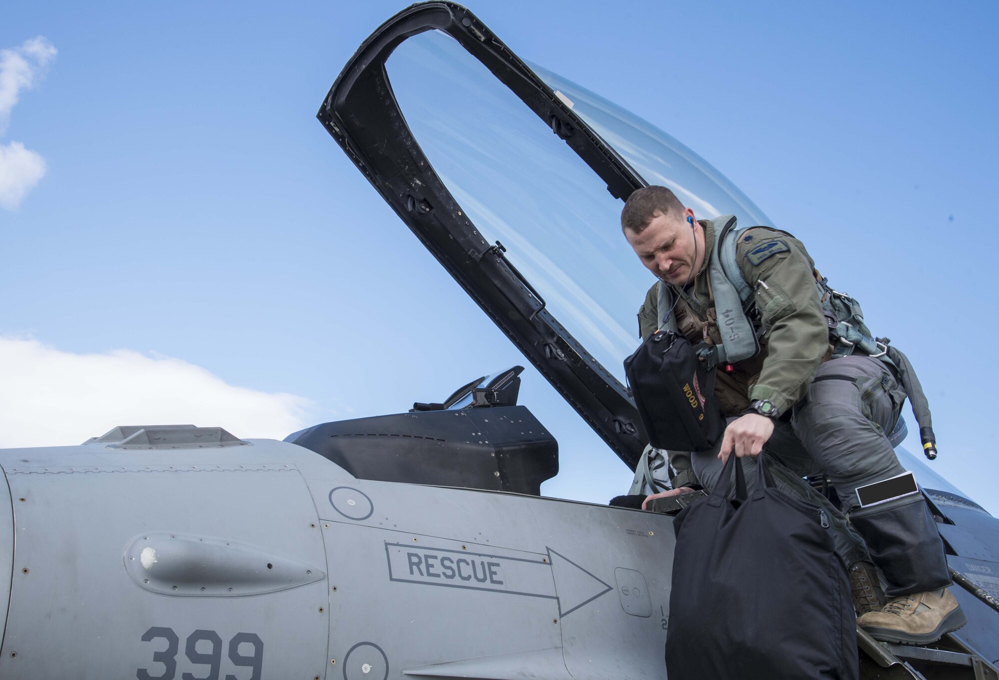 U.S. Air Force Lt. Col. Paul Miller, the deputy commander of the 35th Operations Group, climbs into an F-16 Fighting Falcon during exercise Beverly Sunrise 16-03 at Misawa Air Base, Japan, March 23, 2016. As part of phase II of the operational readiness exercise, Misawa AB simulated a deployment to Kadena Air Base, Japan, during which they conducted contingency operations. (U.S. Air Force photo by Airman 1st Class Jordyn Fetter/Released) 