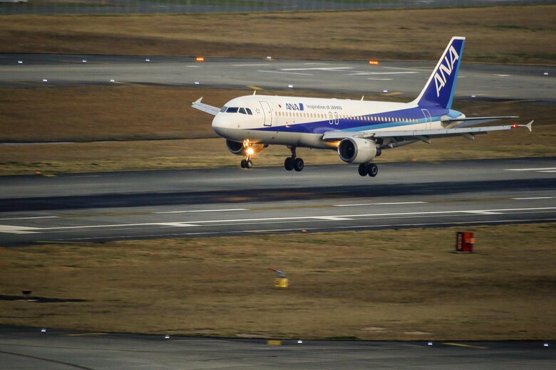 An ANA flight lands on Marine Corps Air Station Iwakuni, Japan, March 25, 2016. On March 27, 2016, The Iwakuni Kintaikyo Airport Use Promotion Council and distinguished guests celebrated the addition of two new flights to the Iwakuni Kintaikyo Airport, March 27, 2016. (U.S. Marine Corps photo by Lance Cpl. Jacob Farbo/Released)