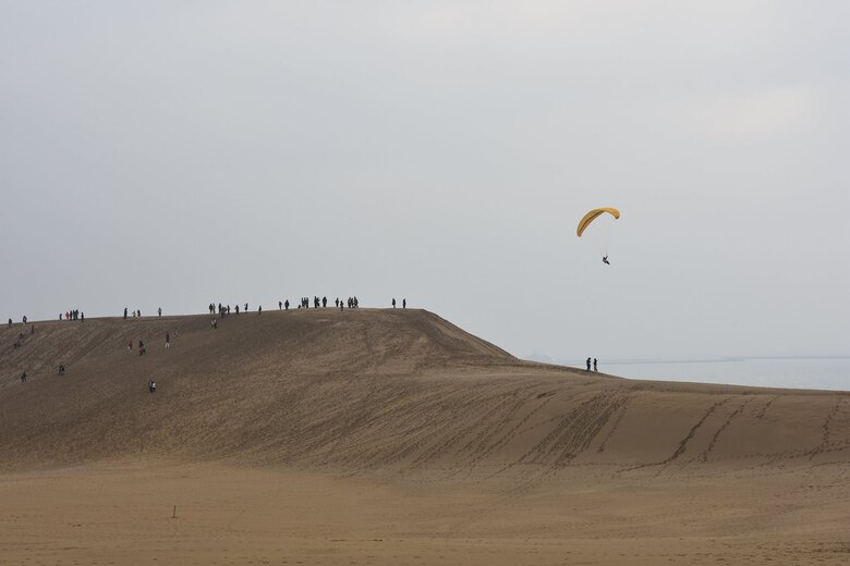 Marines from Marine Corps Air Station Iwakuni traveled to the Tottori Sand Dunes in Tottori Sakyu, Japan, March 19, 2016. After arriving in Tottori, the Marines ventured into the town, observed the scenery, visited temples, rode camels, sand boarded and parasailed. Created by sediment deposits carried from the Chugoku Mountains by the Sendai River into the Sea of Japan over the course of thousands of years, the Tottori Sand Dunes are the largest in Japan and are part of the Sanin Kaigan National Park. (Photo courtesy of Oana Ivanoff)