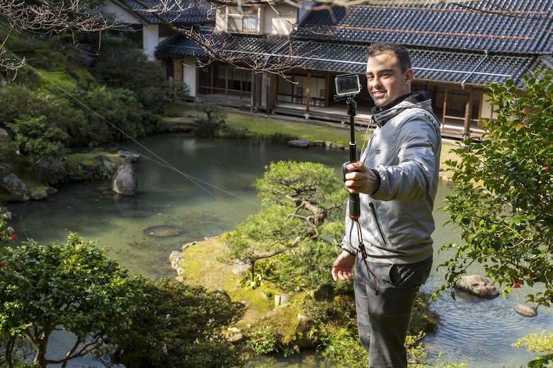 Lance Cpl. Yoan Padezhki, aviation supply specialist with Marine Aerial Refueler Transport Squadron(VMGR) 152, located at Marine Corps Air Station Iwakuni, takes a picture with his camera during a Single Marine Program trip to Kannon-in Temple in Tottori Sakyu, Japan, March 20, 2016. During the two-day trip, Marines also visited the Kannon-in Temple on the eastern side of Tottori City. Constructed during the Edo Period from 1603-1867, the temple is best known for its Japanese-style landscape garden consisting of a large pond surrounded by a lawn and tall pine and maple trees. (U.S. Marine Corps photo by Lance Cpl. Aaron Henson/Released) 