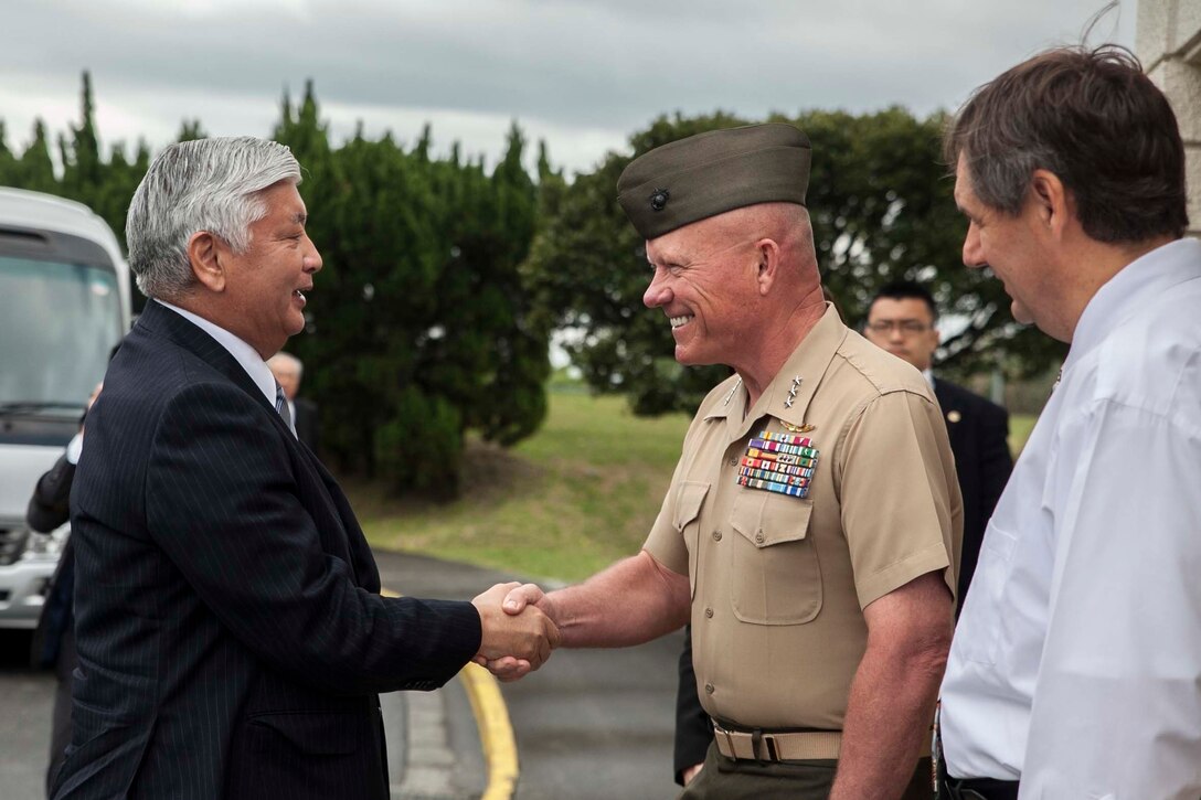 Lt. Gen. Lawrence D. Nicholson, the commanding general of III Marine Expeditionary Force, shakes hands with Gen Nakatani, Japan’s Minister of Defense, at the Butler Officer's Club, Camp Foster, Okinawa, Japan, March 26, 2016. Nicholson and Nakatani discussed the relationship between III MEF and the Okinawa people over lunch.  Nicholson is from Toronto. (U.S. Marine Corps photo by Pfc. Nelson Duenas/ Released)