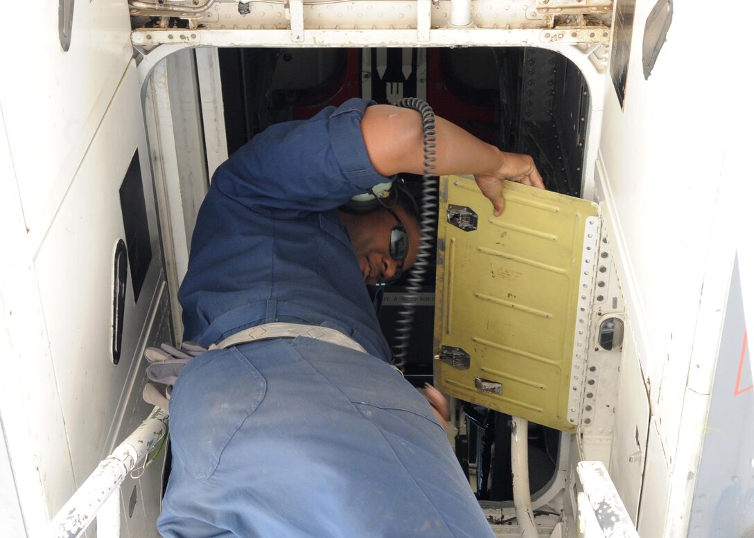 U.S. Air Force Staff Sgt. Jimmel Winkfield, 489th Maintenance Squadron crew chief, works on the refueling system of a B-1B Lancer, March 22, 2016, at Dyess Air Force Base, Texas. Winkfield is an Air Reserve Technician who works with active duty members during the week, assisting them when extra help is needed to ensure the mission continues unhindered. He also performs the same duties one weekend a month for the same unit but as a military member for the Air Force Reserve Command. (U.S. Air Force photo by Senior Airman Shannon Hall/Released)