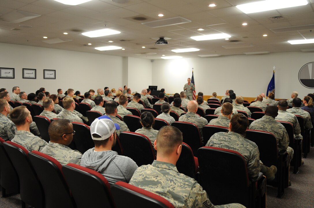 U.S. Air Force Col. Denis Heinz, 489th Bomb Group commander, speaks to his Airmen during their monthly ceremony, March 20, 2016, at Dyess Air Force Base, Texas. The group is made up of Air Reserve Technicians and traditional reservists. While TRs are only required to report for duty one weekend a month and two weeks a year, ARTs carry a dual status working full-time as civil service employees for the Air Force and as military members in the same unit but for the Air Force Reserve Command during their once a month duty obligation. (U.S. Air Force photo by Senior Airman Shannon Hall/Released)