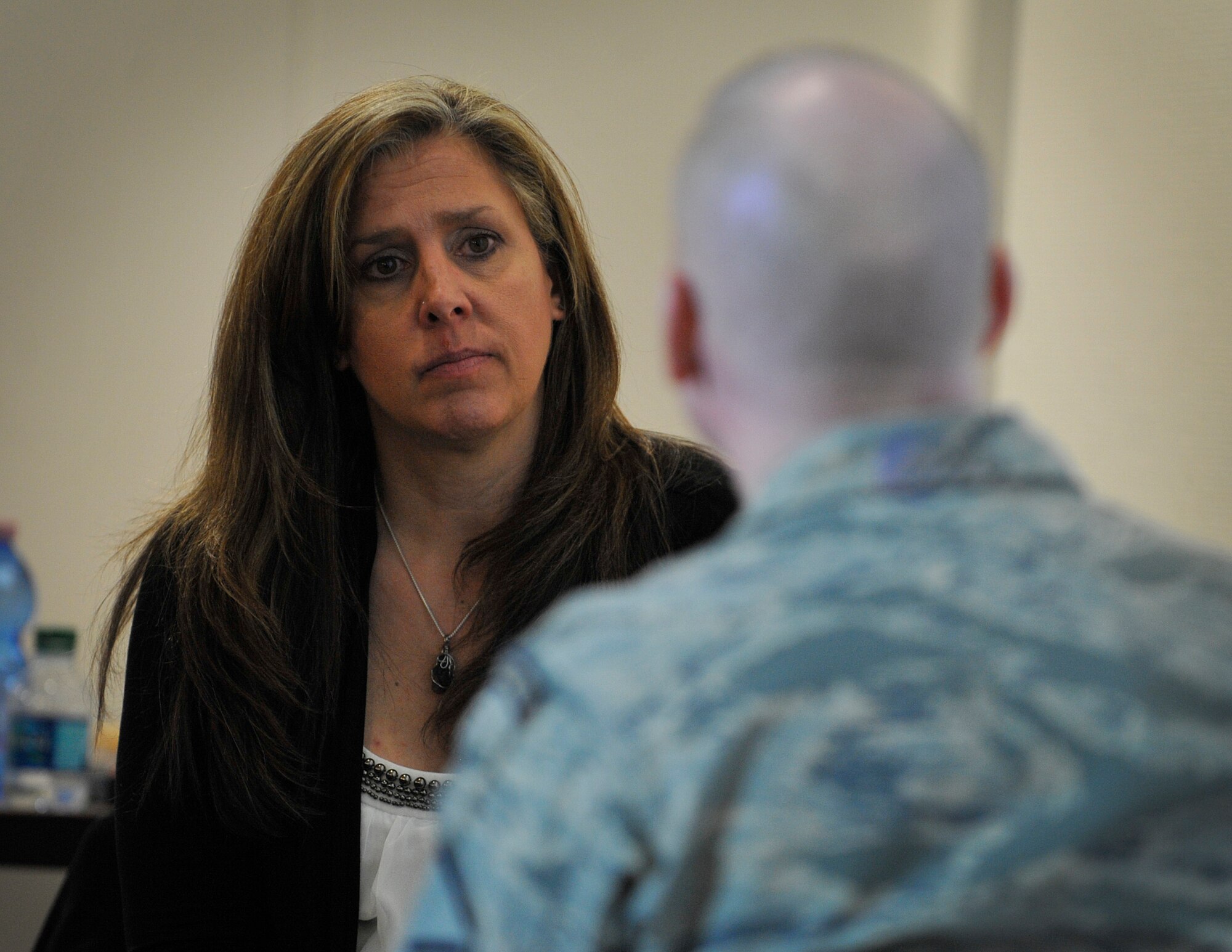 Tina Erzen, Air Force Academy Center for Character and Leadership Development program director, demonstrates how to be a coach during a Core Values Coaching workshop March 21, 2016, at Ramstein Air Base, Germany. The CVC workshop is primarily taught to cadets at the Air Force Academy, and 86th Airlift Wing leaders had the opportunity to become the first operational Air Force members to experience the training. (U.S. Air Force photo/Airman 1st Class Larissa Greatwood)