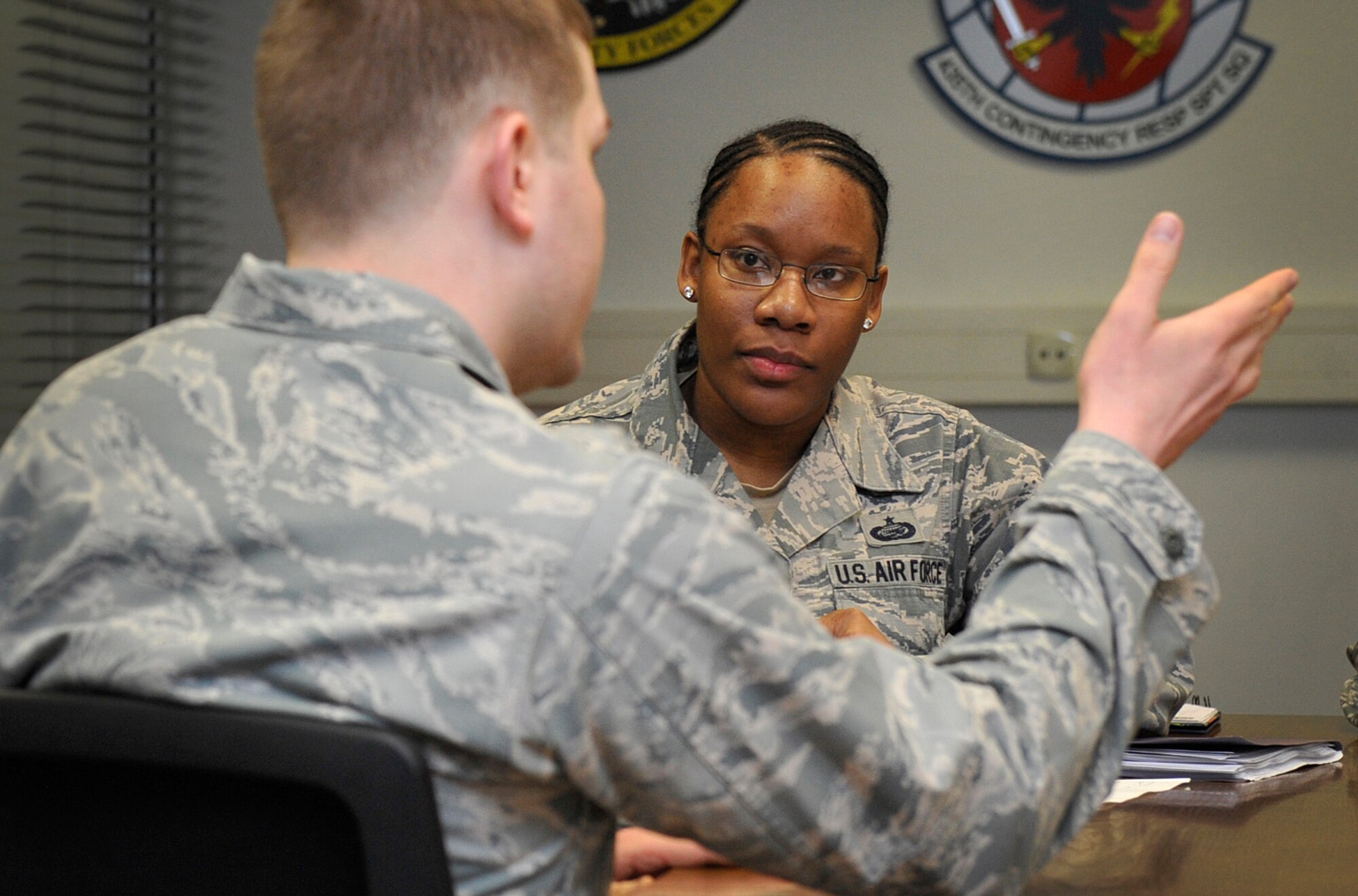 Tech. Sgt. Shajita Rios, 86th Airlift Wing Equal Opportunity advisor, talks with a 435th Air Ground Operations Wing Airmen about the wing’s versatility during an out-and-about March 17, 2016, at Ramstein Air Base, Germany. The 86th AW EO office speaks with Airmen of different units to communicate to the commander the positives in the units and things that may need improvement. (U.S. Air Force photo/Airman 1st Class Larissa Greatwood)
