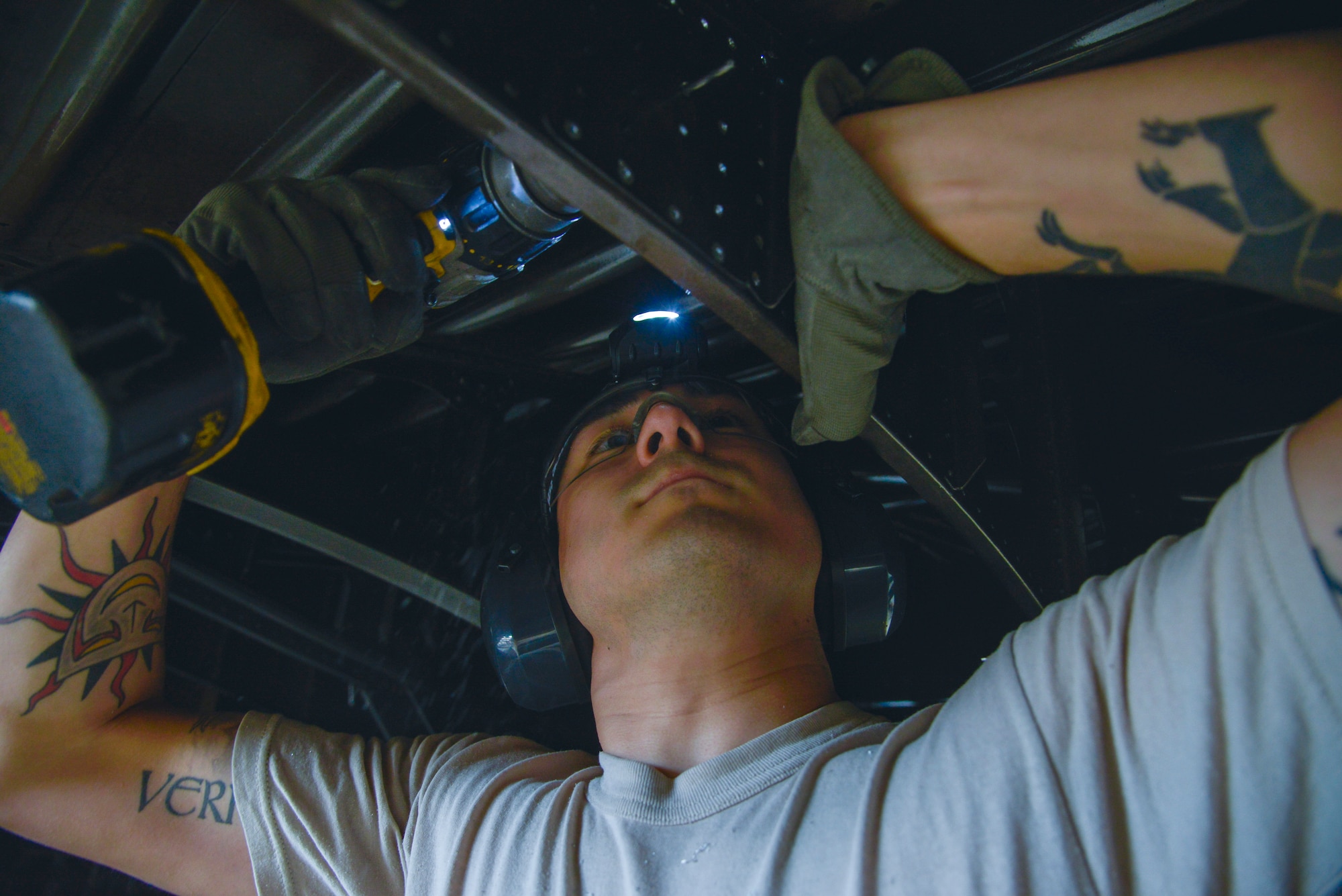 Senior Airman William Napier, 353rd Special Operations Maintenance aircraft structural journeyman, Kadena Air Base, Japan, repairs a section of the MC-130 Talon II at Yokota Air Base, Japan, Feb. 26, 2016. The MC-130 and C-130 Hercules aircraft go through a 14 to 16-day isochronal inspection that is split into four phases: look phase, fix phase, inspection phase and the quality assurance phase. (U.S. Air Force photo by Senior Airman David Owsianka/Released)