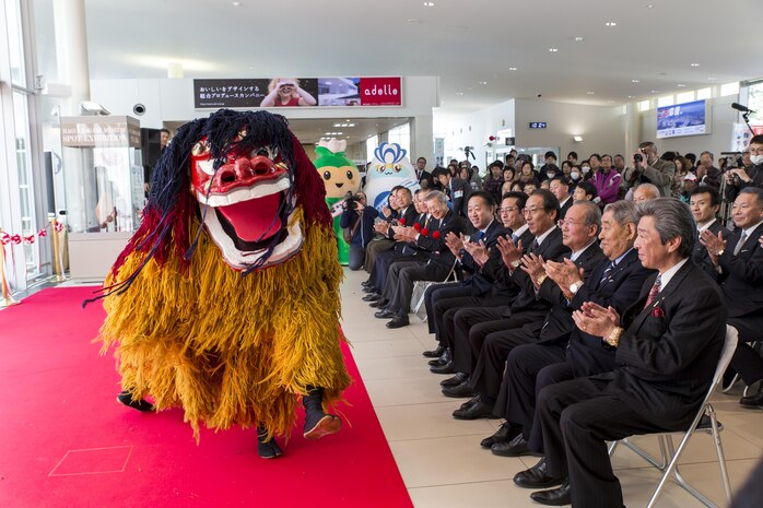 The Iwakuni Kintaikyo Airport Use Promotion Council and distinguished guests celebrate the addition of two new flights to the Iwakuni Kintaikyo Airport March 27, 2016. The celebration included an Eisaa Okinawa Drum Demonstration, a Ryuky-Koku-Matsuri Daiko Drum performance and a ribbon cutting ceremony. Distinguished guests expressed their appreciation toward the Ministry of Defense; Ministry of Land, Infrastructure, and Transport; MCAS Iwakuni and other organizations involved in the adoption of these new flights. The airport and additional flights will contribute to the exchange of people and culture among Iwakuni, Okinawa and other countries in the region. (U.S. Marine Corps photo by Sgt. Antonio J. Rubio/Released) 
