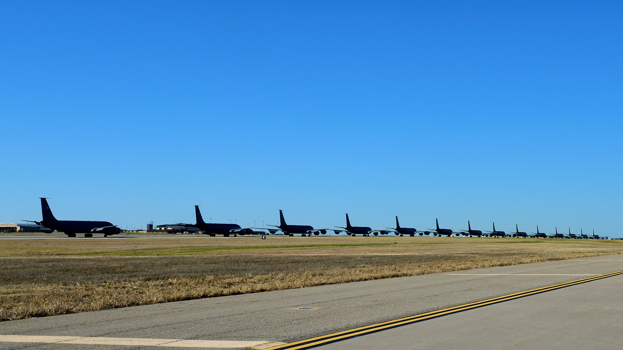 Fourteen KC-135 Stratotankers line up during a simulated alert call, March 24, 2016, at McConnell Air Force Base, Kan. The elephant walk was part of an exercise, which displayed the rapid mobility capabilities and teamwork of the men and women at McConnell to take flight within minutes of being notified of a mission. (U.S. Air Force photos/Senior Airman Trevor Rhynes) 