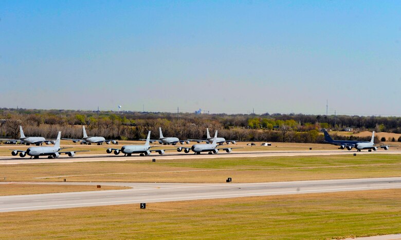 Fourteen KC-135 Stratotankers line up during a simulated alert call, March 24, 2016, at McConnell Air Force Base, Kan. The elephant walk was part of an exercise, which displayed the rapid mobility capabilities and teamwork of the men and women at McConnell to take flight within minutes of being notified of a mission. (U.S. Air Force photos/Senior Airman David Bernal Del Agua) 