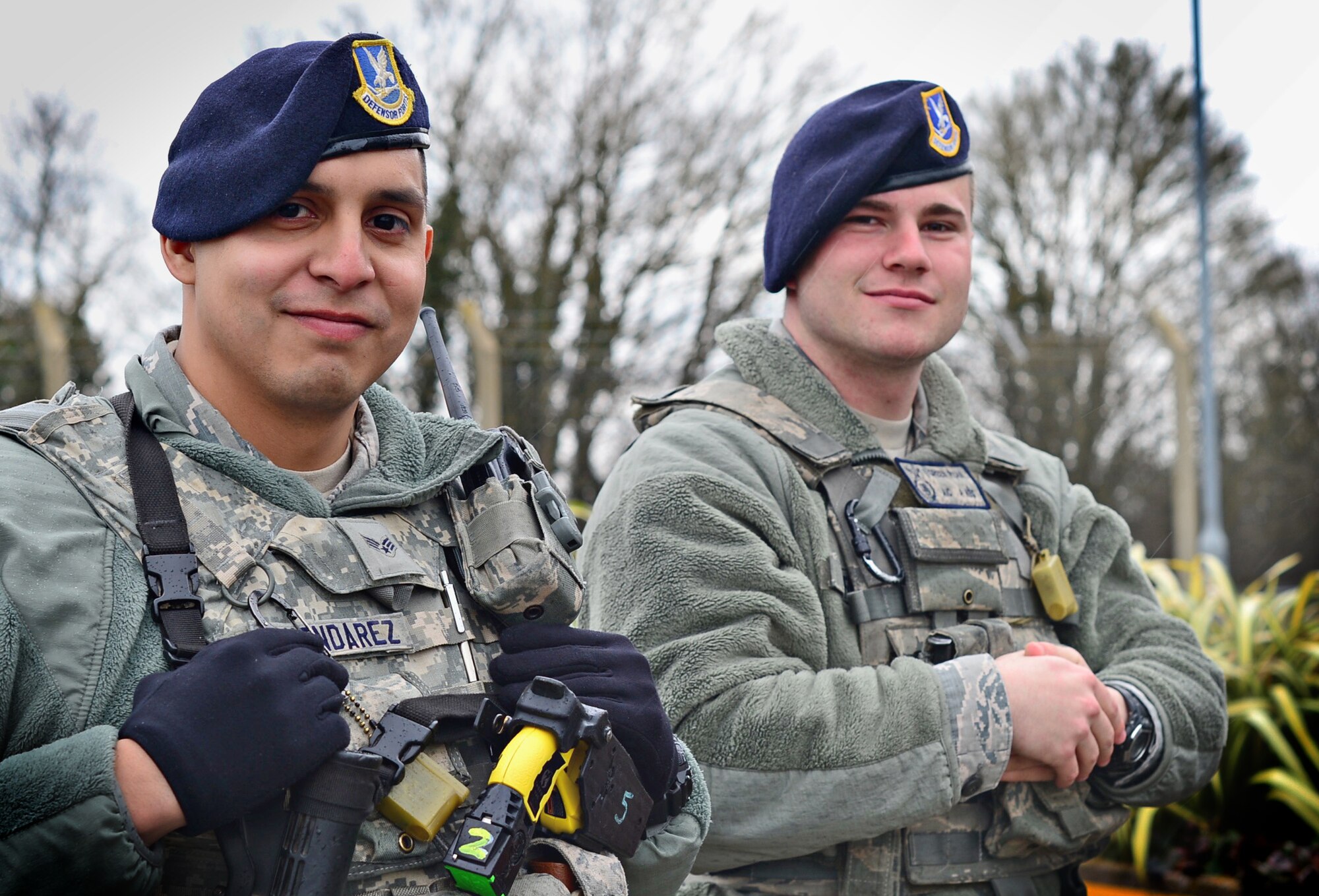 Senior Airman Roland Almendarez and Airman 1st Class Ryan Green, 48th Security Forces Squadron response force members, pose for a photo at the front gate at Royal Air Force Feltwell, England, March 24, 2016. While volunteering at a half marathon, the Airmen employed their medical knowledge to provide critical lifesaving support, when they witnessed a man collapse during the event. (U.S. Air Force photo/Senior Airman Erin Trower) 