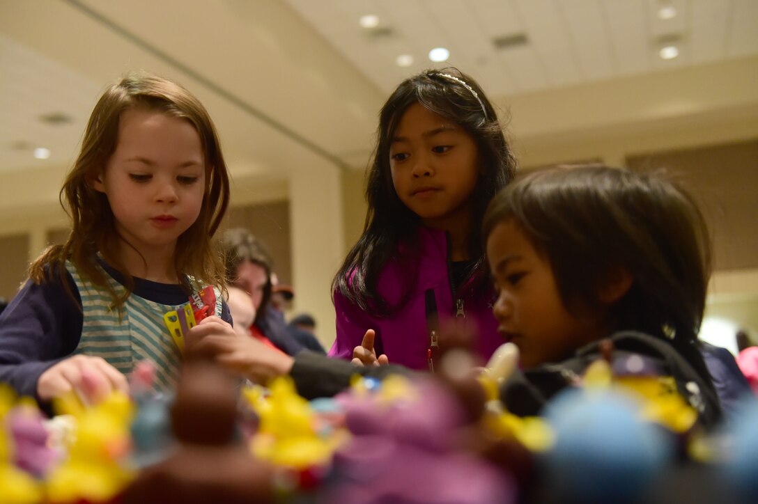 Children from the Buckley Air Force Base Community pick out Easter toys March 26, 2016, at the Leadership Development Center on Buckley AFB, Colo. The annual Breakfast with Bunny event brings families together to celebrate Easter with a free pancake breakfast and hundreds of Easter eggs filled with treats. (U.S. Air Force photo by Airman 1st Class Luke W. Nowakowski/Released)
