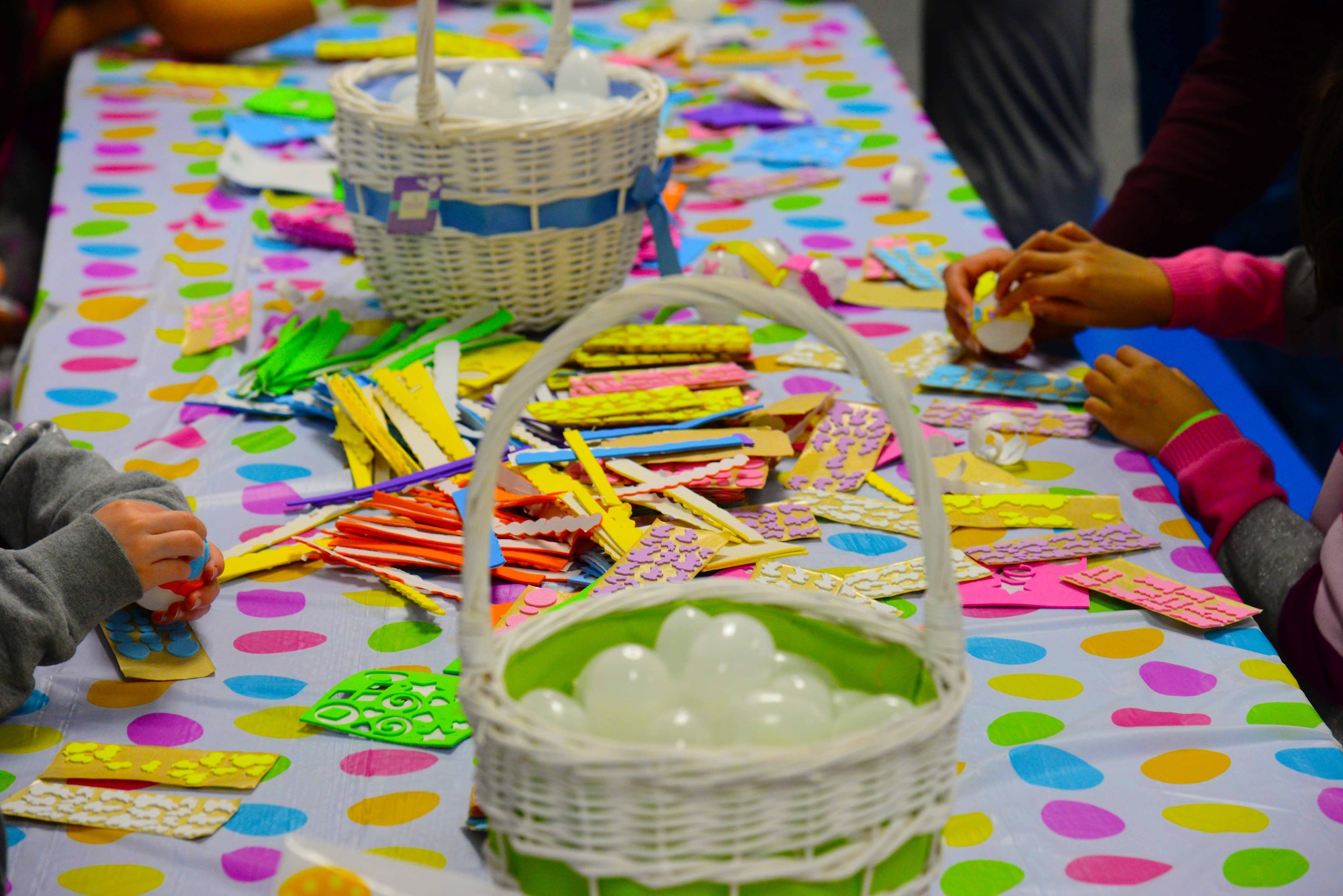 The 341st Force Support Squadron offers an egg decorating booth for children at the annual spring carnival March 26, 2016, at Malmstrom Air Force Base, Mont. Children were able to participate in arts and crafts projects as well as games and competitions to win prizes. (U.S. Air Force photo/Airman 1st Class Magen M. Reeves)