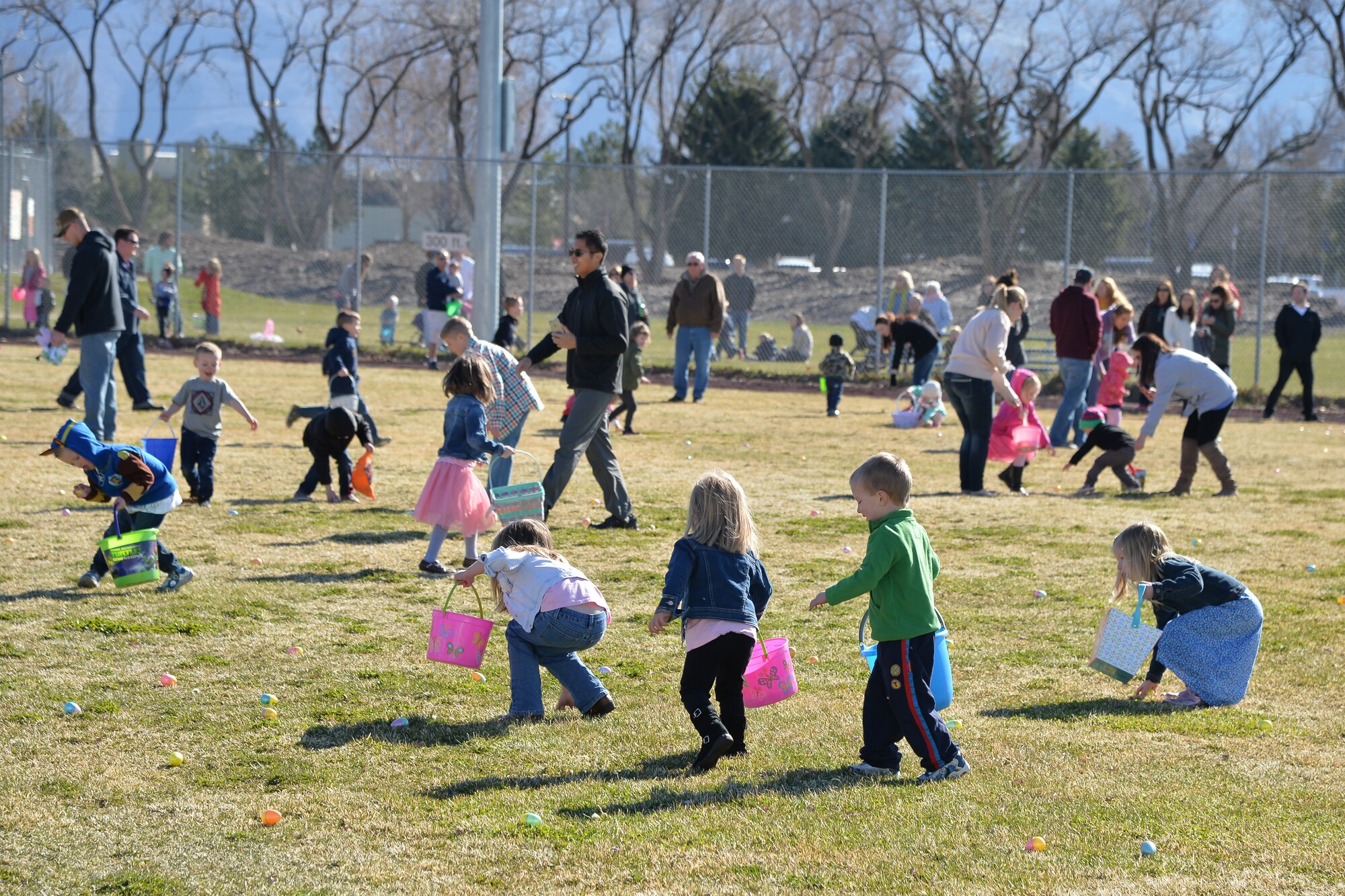 Parents and children participate in an Easter egg hunt March 26 at Hill Air Force Base, Utah. (U.S. Air Force photo by R. Nial Bradshaw)