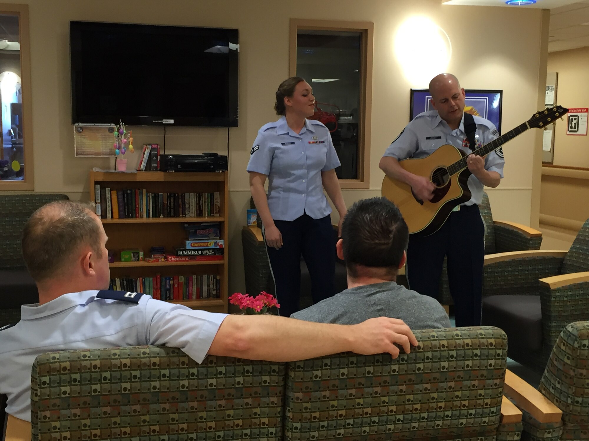Airman First Class Christian Vega was treated to a private concert with the Band of Mid-America during his stay at the Edward Hines, Jr. VA Hospital in Chicago, Ill. The concert was set-up by Jennifer Welch, Air Force Wounded Warrior Program Recovery Care Coordinator from Scott Air Force Base, Ill. Christian is stationed at Joint Base Elmendorf-Richardson, AK. and works as a passenger service agent with the 732nd Air Mobility Support Squadron. ,(Photo provided/Master Sgt. Nicole Shininger)