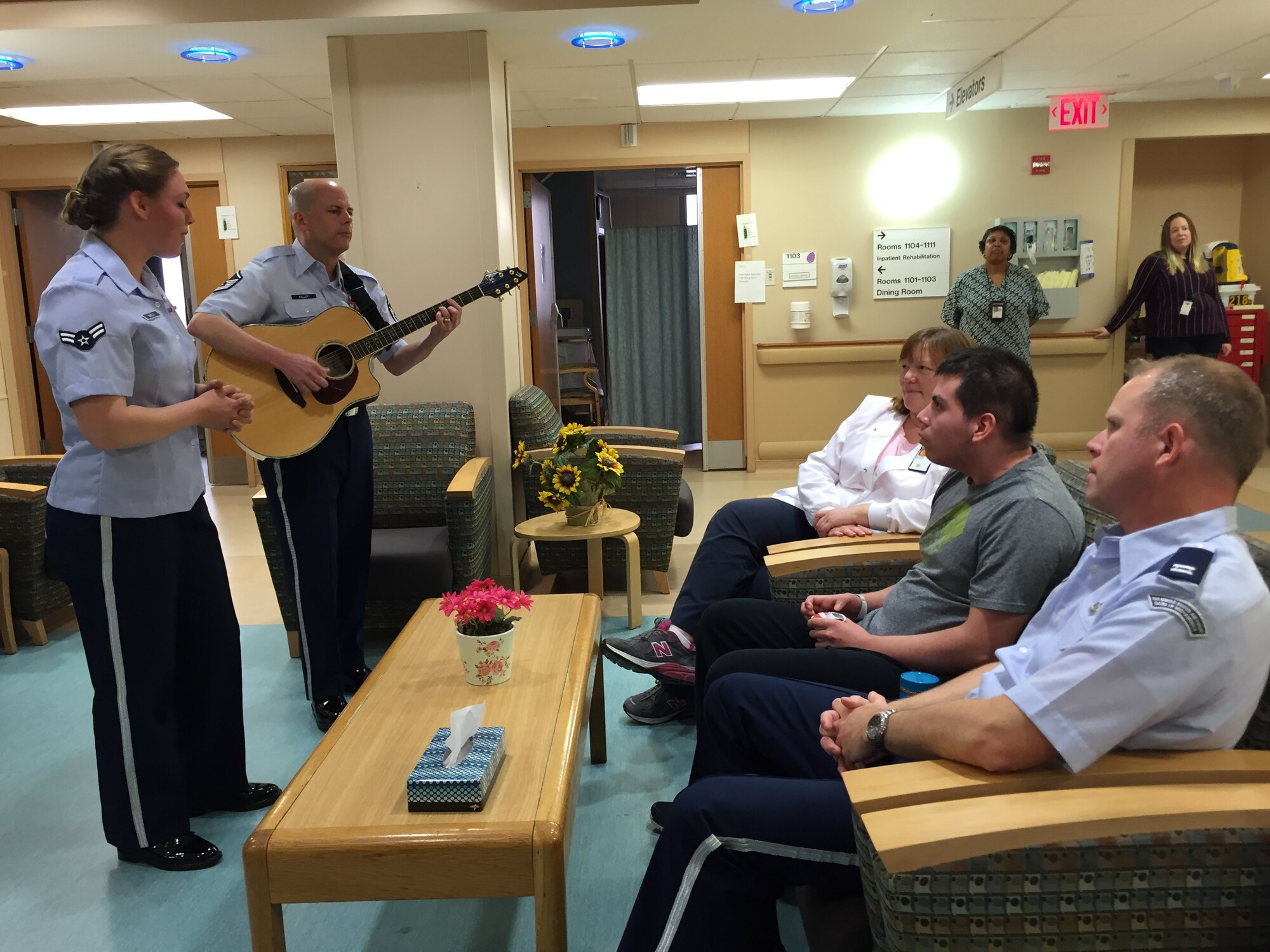 Airman First Class Christian Vega was treated to a private concert with the Band of Mid-America during his stay at the Edward Hines, Jr. VA Hospital in Chicago, Ill. The concert was set-up by Jennifer Welch, Air Force Wounded Warrior Program Recovery Care Coordinator from Scott Air Force Base, Ill. Christian is stationed at Joint Base Elmendorf-Richardson, AK. and works as a passenger service agent with the 732nd Air Mobility Support Squadron. ,(Photo provided/Master Sgt. Nicole Shininger)