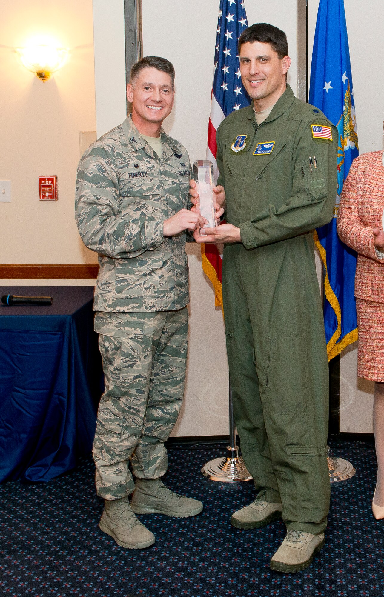 Col. Christopher E. Finerty, the vice commander of the Air National Guard Readiness Center Joint Base Andrews, Md., presents the Senior Field Grade Officer of the Year award to Lt. Col. Mathew G. Brancato during the 2015 ANGRC annual awards ceremony, April 18, 2016. The ceremony recognizes significant contributions in leadership, job performance in their primary duties, self-improvement, and base and community involvement. (Air National Guard photo by Master Sgt. Marvin R. Preston/Released)