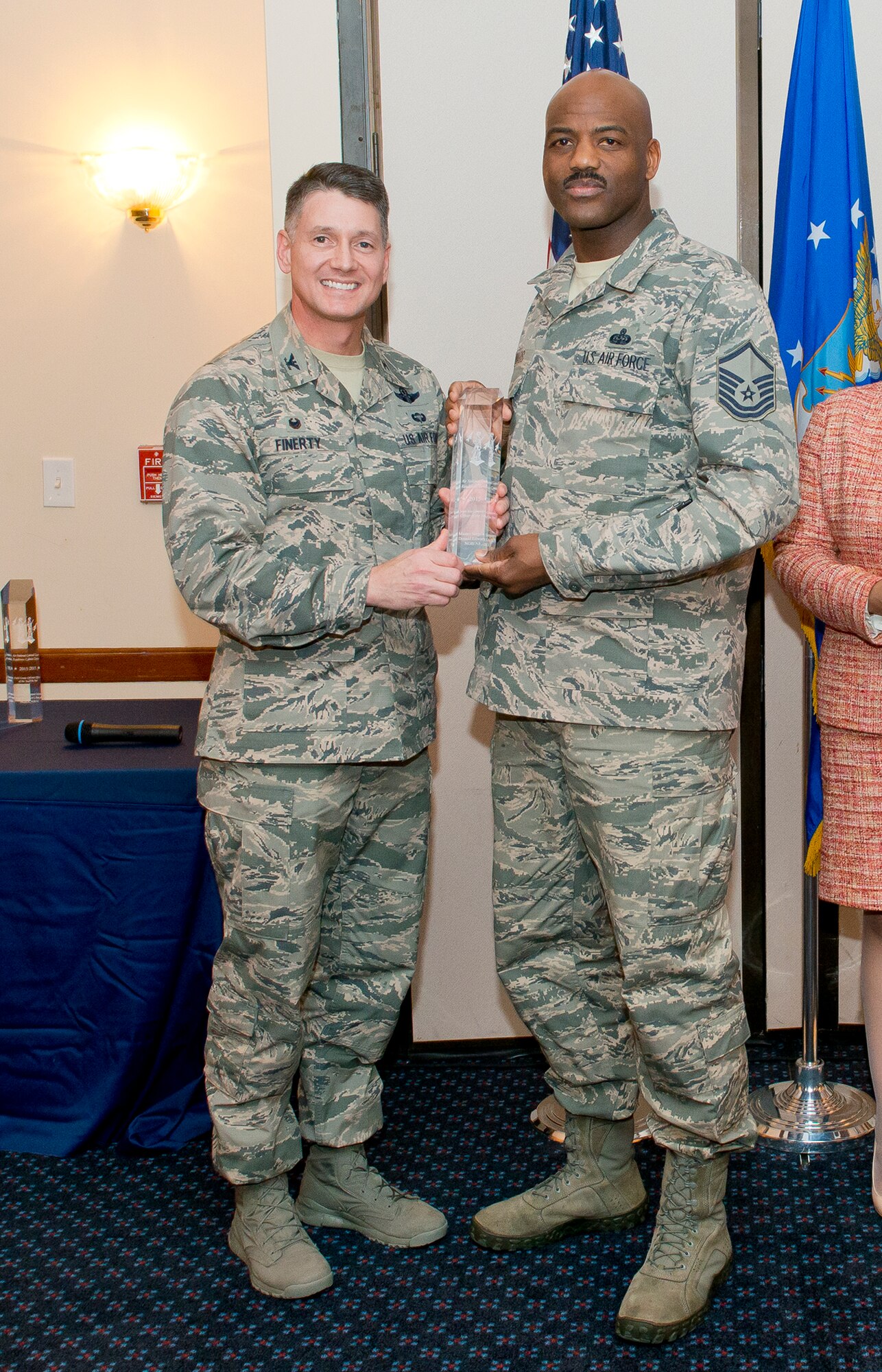 Col. Christopher E. Finerty, the vice commander of the Air National Guard Readiness Center Joint Base Andrews, Md., presents the Senior Non-Commissioned Officer of the Year award to Master Sgt. Donald Edwards during the 2015 ANGRC annual awards ceremony, April 18, 2016. The ceremony recognizes significant contributions in leadership, job performance in their primary duties, self-improvement, and base and community involvement. (Air National Guard photo by Master Sgt. Marvin R. Preston/Released)