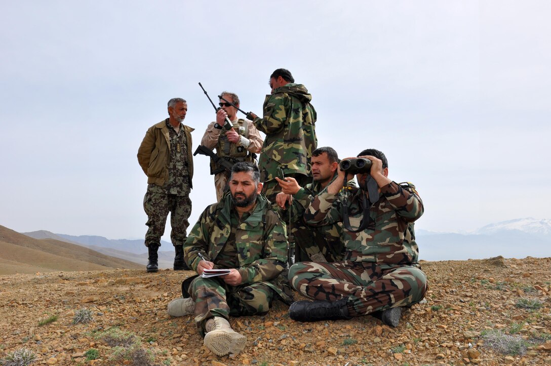 Afghan Tactical Air Controllers call-in an air strike at a training range near Kabul, Afghanistan, March 27, 2016, while a Train, Advise, Assist Command-Air (TAAC-Air) Czech Republic air advisor assists from the rear. The Afghan National Army and Afghan Air Force coordinated live-fire training for A-29 Super Tucano and MD-530 “Jengi” attack aircraft. The ATACs coordinate requests for air casualty evacuation, close air support, aerial resupply and airlift. They also deconflict air-to-ground fires from ground-to-ground fires for ANA operations. (U.S. Air Force photo by Capt. Eydie Sakura/released)