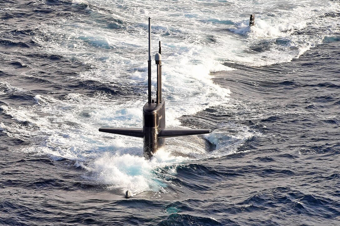 The attack submarine USS Helena transits the Atlantic Ocean, March 24, 2016. The Helena and the USS Dwight D. Eisenhower are conducting a composite training unit exercise. Navy photo by Petty Officer 1st Class Rafael Martie