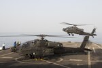 AH-64 Apache helicopters from 3rd Squadron, 6th Cavalry Regiment, land aboard the USS Ponce, an Afloat Forward Staging Base, during an interoperability training exercise in the Persian Gulf March 17. The exercise tested the ability of 40th CAB and the USS Ponce to work together to perform stability operations in the surrounding region. 