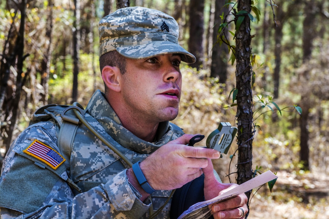 Army Sgt. David Brown uses a compass to navigate to his first point during the day land navigation event at the 2016 Best Warrior competition at Fort Jackson, S.C., March 21, 2016. Brown is assigned to the 98th Training Division. The competition will determine the top noncommissioned officer and junior enlisted soldier who will represent the 108th Training Command at the Army Reserve Best Warrior competition later this year at Fort Bragg, N.C. Army photo by Sgt. 1st Class Brian Hamilton