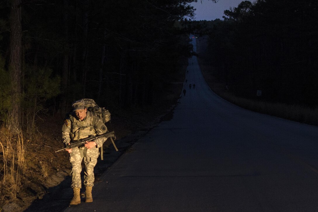 A soldier starts the second day of the 2016 Best Warrior competition with a 12-mile ruck march at Fort Jackson, S.C., March 22, 2016. Army photo by Sgt. 1st Class Brian Hamilton