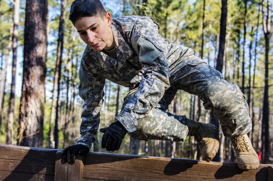 Army Staff Sgt. Beth Juliar hurdles the low wall at the endurance obstacle course during the 2016 Best Warrior competition at Fort Jackson, S.C., March 23, 2016. Juliar is assigned to the 4th Brigade, 98th Training Division. Army photo by Sgt. 1st Class Brian Hamilton