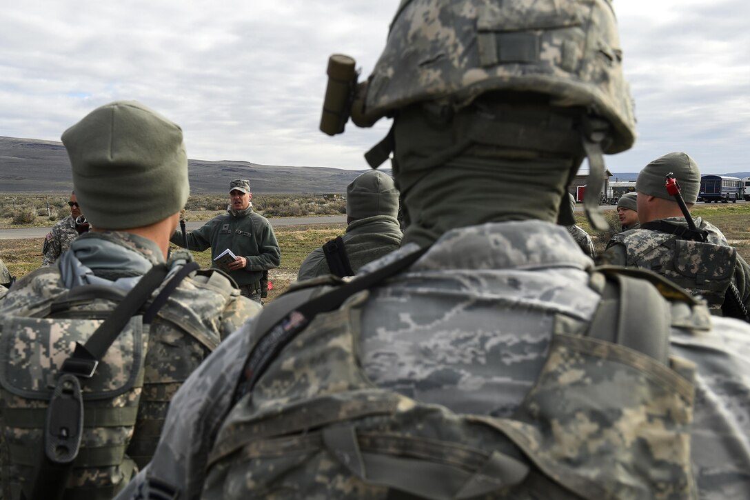 Air Force Col. Thomas Seeker, center left, briefs airmen, soldiers and members from the Defense Logistics Agency during Exercise Turbo Distribution 16-02 at Amedee Army Airfield, Calif., March 15, 2016. Seeker is deputy commander of the 821st Contingency Response Group and commander of Joint Task Force Port Opening. The exercise evaluates mobility operations and expeditionary combat support. Air Force photo by Staff Sgt. Robert Hicks