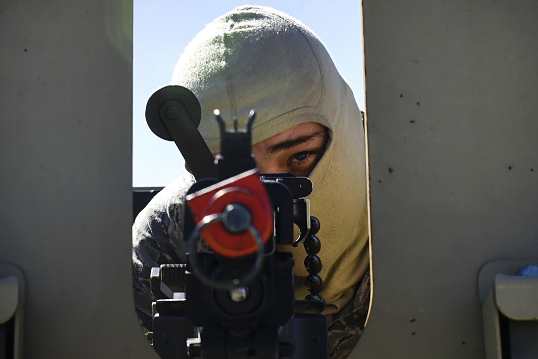 Air Force Senior Airman Dylan Saimes looks down his weapon's iron sights while providing security at an entry control point during Exercise Turbo Distribution 16-02 at Amedee Army Airfield, Calif., March 15, 2016. Saimes is assigned to the 821st Contingency Response Squadron. Air Force photo by Staff Sgt. Robert Hicks