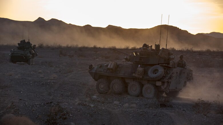 Light armored vehicles with Company B, 3rd Light Armored Reconnaissance Battalion, move into a security position in the Combat Center training area March 24, 2016, during a Marine Corps Combat Readiness Evaluation Exercise. 3rd LAR conducted a five-day MCCREE to evaluate the combat readiness of B Co.