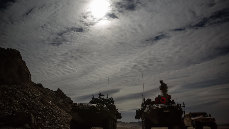 Light armored vehicles with Company B, 3rd Light Armored Reconnaissance Battalion, set up security along a road at night in the Combat Center training area March 21, 2016, during a Marine Corps Combat Readiness Evaluation Exercise. 3rd LAR conducted a five-day MCCREE to evaluate the combat readiness of B Co.