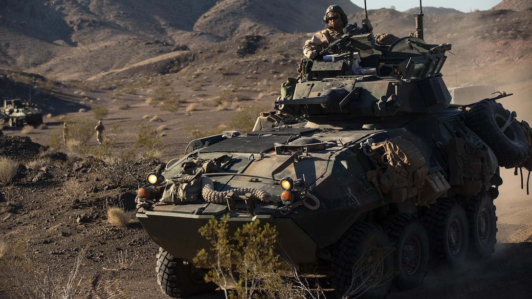 A light armored vehicle with Company B, 3rd Light Armored Reconnaissance Battalion, maneuvers into a security position in the Combat Center training area March 22, 2016, during a Marine Corps Combat Readiness Evaluation Exercise. 3rd LAR conducted a five-day MCCREE to evaluate the combat readiness of B Co. 
