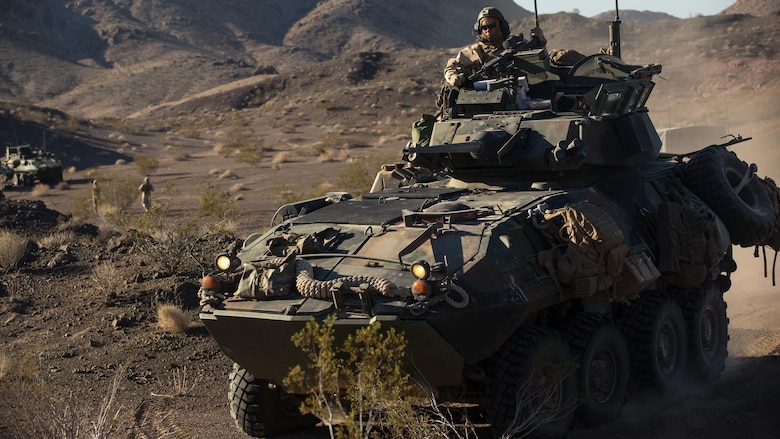 A light armored vehicle with Company B, 3rd Light Armored Reconnaissance Battalion, maneuvers into a security position in the Combat Center training area March 22, 2016, during a Marine Corps Combat Readiness Evaluation Exercise. 3rd LAR conducted a five-day MCCREE to evaluate the combat readiness of B Co. 