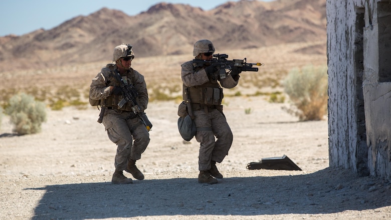 Marines with Company B, 3rd Light Armored Reconnaissance Battalion, participate in an assault on the military operations on urban terrain town at Range 210 in the Combat Center training area March 24, 2016, during a Marine Corps Combat Readiness Evaluation Exercise. 3rd LAR conducted a five-day MCCREE to evaluate the combat readiness of B Co. 