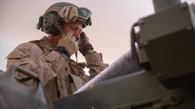 1st Lt. Zzmarr L. Stone, executive officer, Company B, 3rd Light Armored Reconnaissance Battalion, reads a map in the Combat Center training area March 21, 2016, during a Marine Corps Combat Readiness Evaluation Exercise. 3rd LAR conducted a five-day MCCREE to evaluate the combat readiness of B Co. 