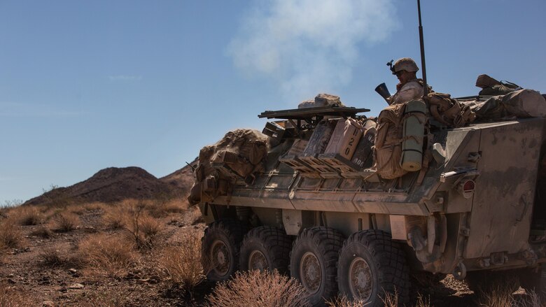 A Marine with Company B, 3rd Light Armored Reconnaissance Battalion, fires a light armored vehicle mounted mortar in the Combat Center training area March 25, 2016, during a Marine Corps Combat Readiness Evaluation Exercise. 3rd LAR conducted a five-day MCCREE to evaluate the combat readiness of B Co. 