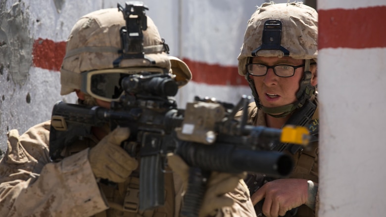 Marines with Company B, 3rd Light Armored Reconnaissance Battalion, participate in an assault on the Military Operations on Urban Terrain town located at Range 210 in the Combat Center training area March 24, 2016, during a Marine Corps Combat Readiness Evaluation Exercise. 3rd LAR conducted a five-day MCCREE to evaluate the combat readiness of B Co. 